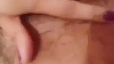 Indian girl nude MMS of a girl fingering her hairy pussy