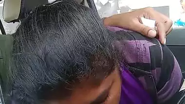 Telugu woman gives a desi blowjob to her man in a car