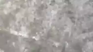 MILF dries hair and body outdoors being filmed by an Indian perv