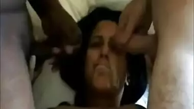 Hot brunette takes their cum on her face