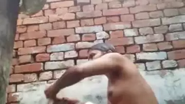 Young desi woman sets the camera on and starts her XXX shower show