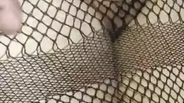 Hot Desi babe in fishnet dress has her pussy XXX rubbed by lover